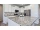 Well-appointed kitchen showcasing granite countertops, stainless appliances, and ample storage with sleek cabinetry and modern fixtures at 21482 E Idyllwilde Dr, Parker, CO 80138