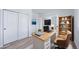Bright, functional office space with French doors, built-in shelving, and neutral decor at 21482 E Idyllwilde Dr, Parker, CO 80138
