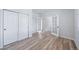Office with ample space, wood floors, and glass paneled doors leading to another room, providing a bright and functional workspace at 21482 E Idyllwilde Dr, Parker, CO 80138