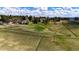 Aerial view showcasing the property's expansive fenced in acreage at 17800 E Hinsdale Ave, Foxfield, CO 80016