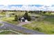 Sprawling property with a home, garage, barn, and fenced pastures at 17800 E Hinsdale Ave, Foxfield, CO 80016