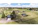 Expansive aerial view of a home with pastures, outbuildings, and fencing at 17800 E Hinsdale Ave, Foxfield, CO 80016