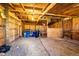 Barn interior with wood walls, exposed ceiling, and dirt floor at 17800 E Hinsdale Ave, Foxfield, CO 80016