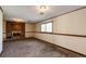 Spacious finished basement area, complete with brick fireplace and window for natural light at 17800 E Hinsdale Ave, Foxfield, CO 80016