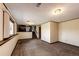 Finished basement space featuring plush carpeting and access to upper levels at 17800 E Hinsdale Ave, Foxfield, CO 80016