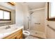 Accessible bathroom featuring a step-in shower and vanity sink at 17800 E Hinsdale Ave, Foxfield, CO 80016