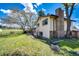 Exterior of the home showing the lawn and brick chimney at 17800 E Hinsdale Ave, Foxfield, CO 80016