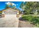 Two-story home with a two-car garage and concrete driveway at 17800 E Hinsdale Ave, Foxfield, CO 80016