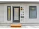 Home front door features a smart lock and is framed by contemporary windows at 2164 S Ash St, Denver, CO 80222