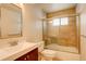 Modern bathroom featuring tiled shower over tub, vanity, and fixtures at 3127 And 3125 N Raleigh St, Denver, CO 80212
