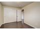Bedroom featuring hardwood floors, neutral walls, and a closet at 3127 And 3125 N Raleigh St, Denver, CO 80212
