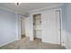 Bedroom with light blue walls, neutral carpet, and closet with shelving at 3127 And 3125 N Raleigh St, Denver, CO 80212
