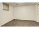 A bright bedroom with neutral carpeting and small window to let in natural light at 3127 And 3125 N Raleigh St, Denver, CO 80212