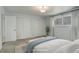 Cozy bedroom featuring ample closet space, neutral decor, and soft natural lighting at 3127 And 3125 N Raleigh St, Denver, CO 80212