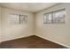Bedroom featuring hardwood floors and large windows at 3127 And 3125 N Raleigh St, Denver, CO 80212