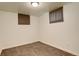 Bedroom featuring neutral carpet, white painted walls, two small windows and base trim at 3127 And 3125 N Raleigh St, Denver, CO 80212