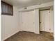 Bedroom featuring neutral carpet, white painted walls, closet, and base trim at 3127 And 3125 N Raleigh St, Denver, CO 80212
