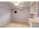 Bedroom with modern light fixture and built-in shelving at 3127 And 3125 N Raleigh St, Denver, CO 80212