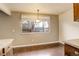 Dining area featuring hardwood floors, pendant lighting and large windows at 3127 And 3125 N Raleigh St, Denver, CO 80212