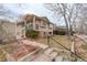View of home exterior with steps leading to front door and stone foundation at 3127 And 3125 N Raleigh St, Denver, CO 80212