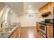 Spacious kitchen featuring light wood cabinets, stainless steel appliances, and dark countertops at 3127 And 3125 N Raleigh St, Denver, CO 80212