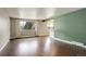 Bright and airy living room featuring wood floors, windows, and a neutral color scheme at 3127 And 3125 N Raleigh St, Denver, CO 80212