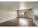 Bright and airy living room featuring wood floors, windows, and a neutral color scheme at 3127 And 3125 N Raleigh St, Denver, CO 80212