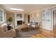 Bright living room with a fireplace, hardwood floors, and an abundance of natural light at 3127 And 3125 N Raleigh St, Denver, CO 80212
