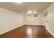 Cozy living room with a large window and hardwood flooring for a modern, comfortable feel at 3127 And 3125 N Raleigh St, Denver, CO 80212