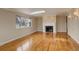 Spacious living room featuring hardwood floors, a fireplace, and a skylight at 3127 And 3125 N Raleigh St, Denver, CO 80212