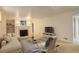 Spacious living room with a fireplace, plush seating, and carpeted floors at 3127 And 3125 N Raleigh St, Denver, CO 80212
