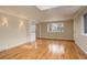 Living room featuring hardwood floors, neutral walls, and natural light from large windows at 3127 And 3125 N Raleigh St, Denver, CO 80212