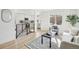 Bright living room showcasing hardwood floors and modern decor with stairs leading to the kitchen at 3630 N Saint Paul St, Denver, CO 80205