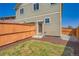 Fenced backyard featuring grass and a small patio at 11709 Park South Ln, Parker, CO 80138