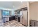 An open kitchen features stainless steel appliances and an adjacent dining area at 11709 Park South Ln, Parker, CO 80138