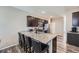 Kitchen featuring a large island with granite countertops and seating for four at 11709 Park South Ln, Parker, CO 80138