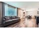Bright living room featuring modern floors, a comfortable sofa, and neutral decor at 11709 Park South Ln, Parker, CO 80138