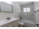 Updated bathroom featuring a shower-tub combo and single sink vanity with updated fixtures at 967 Victor St, Aurora, CO 80011