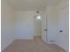 Bedroom with neutral carpeting and attached closet and doorways at 967 Victor St, Aurora, CO 80011