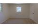 A simple bedroom with beige walls and carpet at 967 Victor St, Aurora, CO 80011