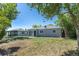 A quaint one story house with a well-maintained lawn and neutral-colored exterior at 967 Victor St, Aurora, CO 80011