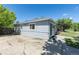 Side view of the house featuring a well-maintained lawn, and a classic exterior design at 967 Victor St, Aurora, CO 80011
