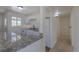 Bright kitchen featuring white cabinets, granite countertops, and modern appliances at 967 Victor St, Aurora, CO 80011
