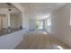 Living room with a view into the kitchen and front door with a carpeted floor at 967 Victor St, Aurora, CO 80011