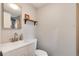 Clean bathroom with modern vanity, shelf, and toilet at 3175 S Pennsylvania St, Englewood, CO 80113