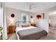 Bedroom with a ceiling fan and rustic wooden bedside tables at 3175 S Pennsylvania St, Englewood, CO 80113