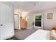 Bedroom with a view, ceiling fan, and door to bathroom at 3175 S Pennsylvania St, Englewood, CO 80113