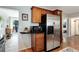 Kitchen area with stainless steel refrigerator and microwave at 3175 S Pennsylvania St, Englewood, CO 80113