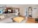 Open-concept living area with modern finishes, hardwood floors, and easy access to kitchen at 3175 S Pennsylvania St, Englewood, CO 80113