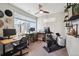 Bright home office with dual monitors, shelves, and exercise equipment offers a modern workspace at 3814 Zenobia St, Denver, CO 80212